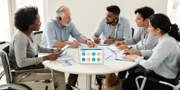Diverse group discussing disability benefits documents and tablet